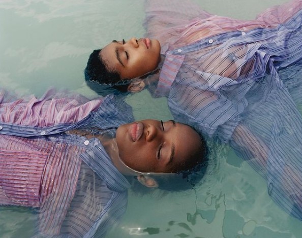 two women are floating in a pool of water