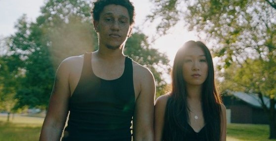 a man and a woman standing next to each other