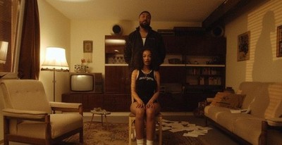 a man and a woman standing in a living room