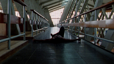 a person laying on the ground in a building