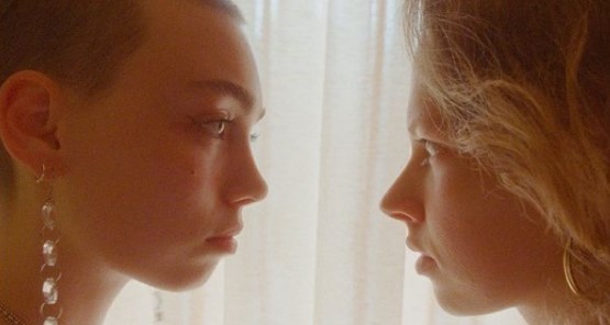 a couple of women standing next to each other