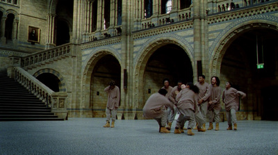 a group of people standing in front of a building