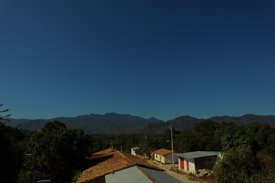 a view of a mountain range from a rooftop