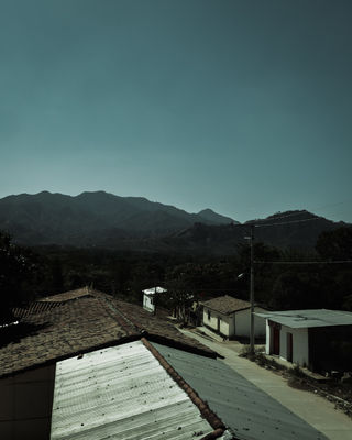 a view of a mountain range from a rooftop