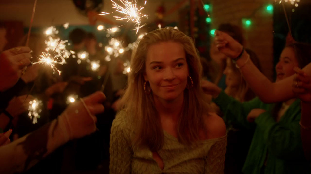 a group of people holding sparklers in their hands