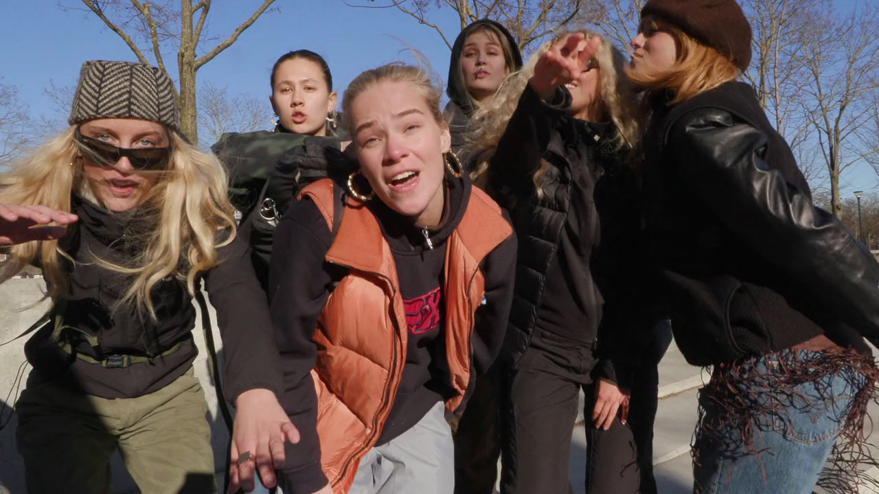 a group of young women standing next to each other