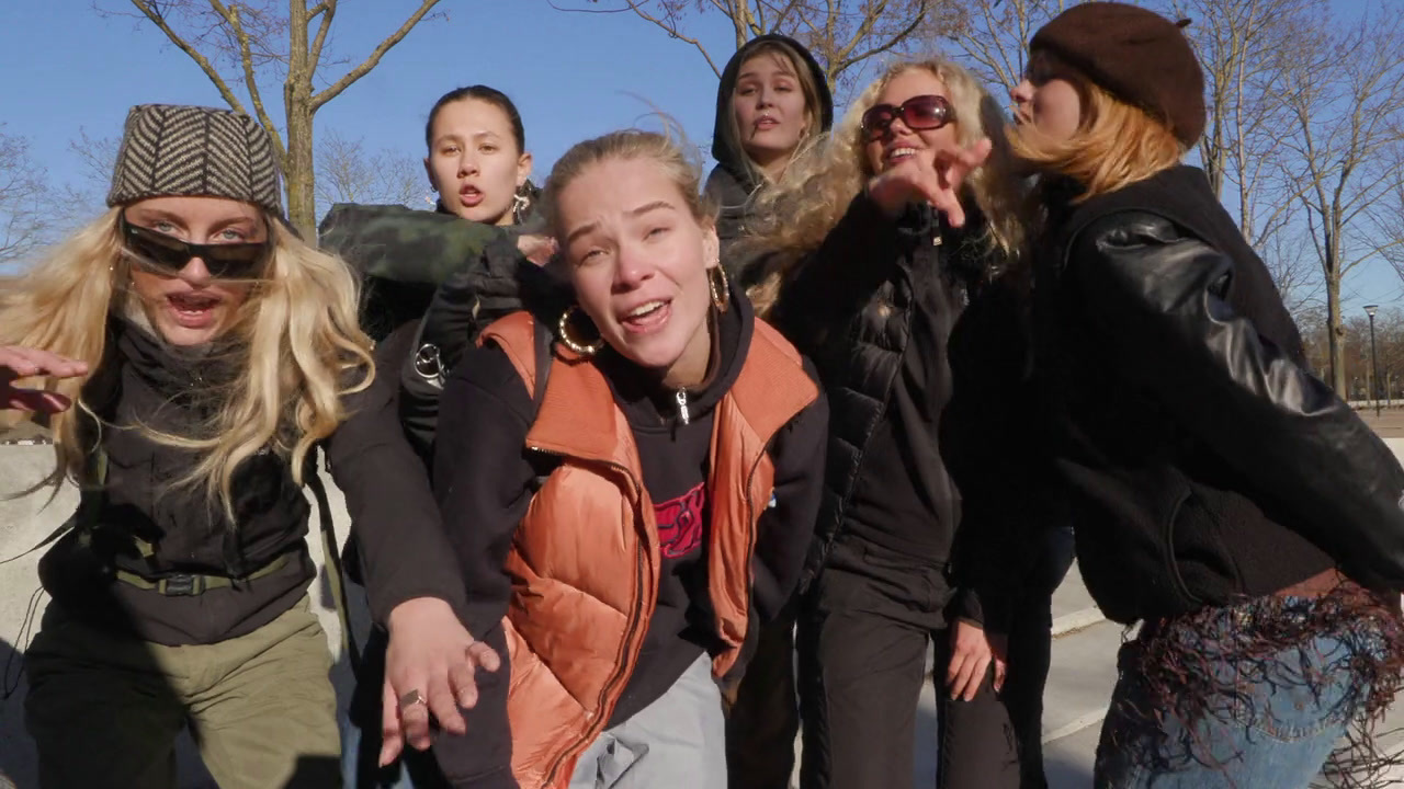 a group of young women standing next to each other