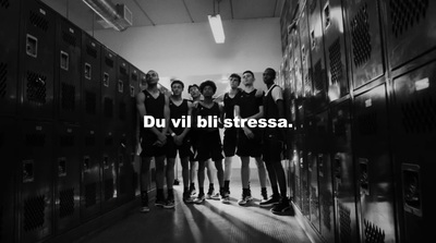 a group of people standing in front of lockers