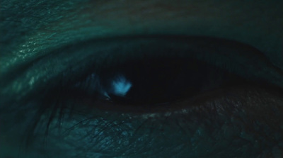 a close up of a person's blue eye