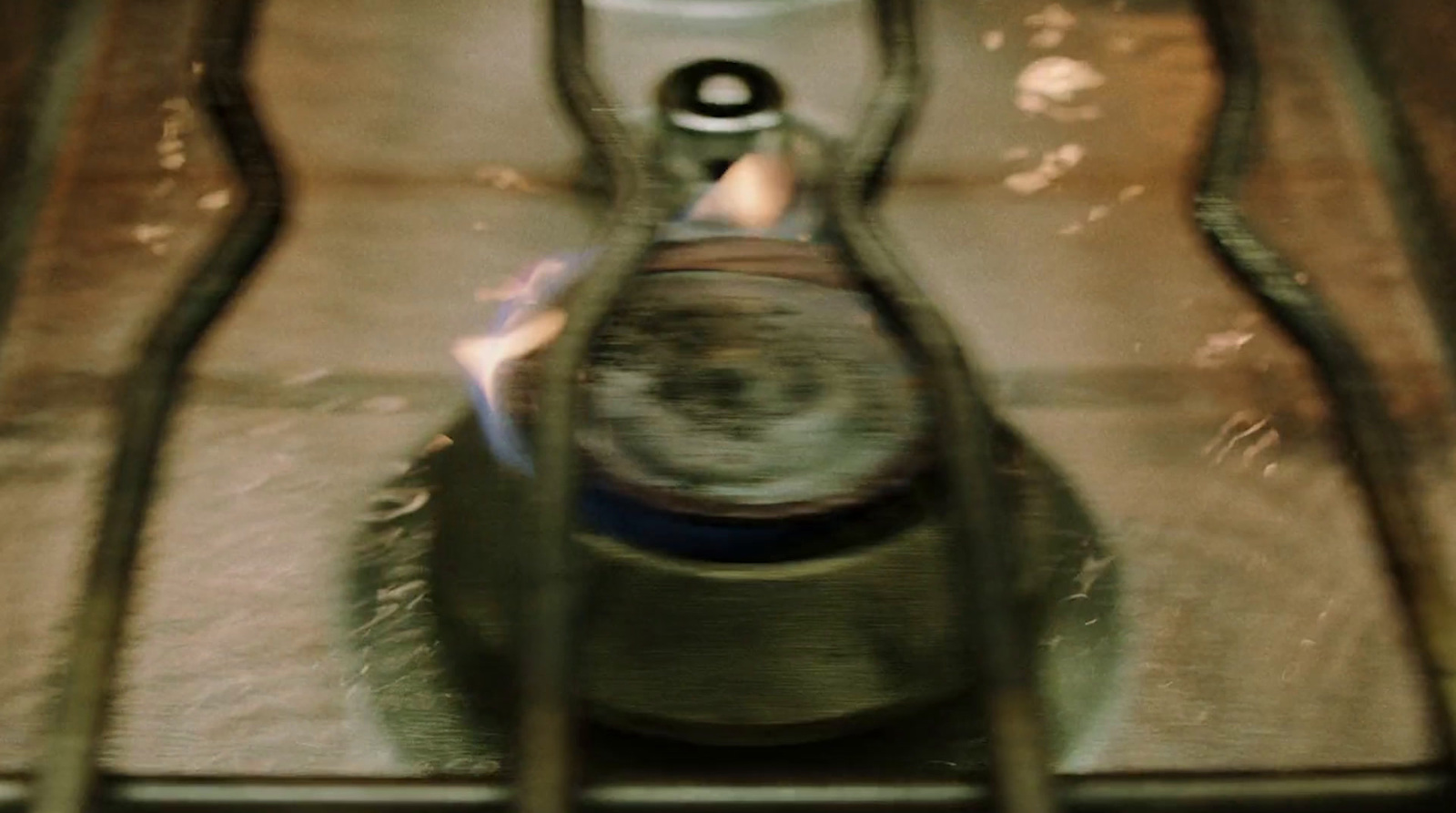 a clock sitting on top of a metal shelf