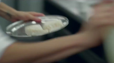 a close up of a person holding a plate of food