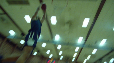 a blurry photo of a basketball player in the air