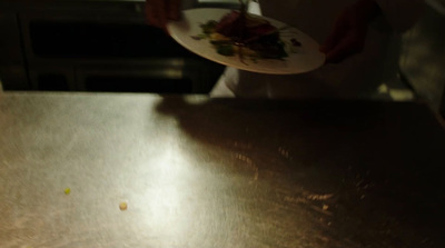 a person holding a plate with food on it