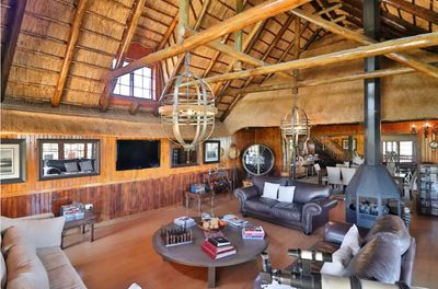 a living room filled with furniture and a fire place