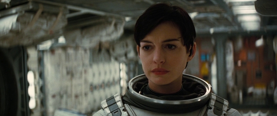 a woman in a space suit looking at the camera