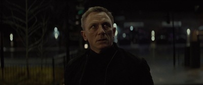 a man in a black jacket looking at the camera