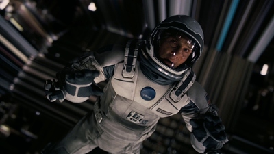 a man in a space suit standing in a room