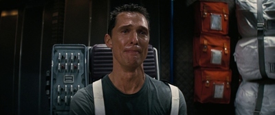 a man standing in front of a server in a server room