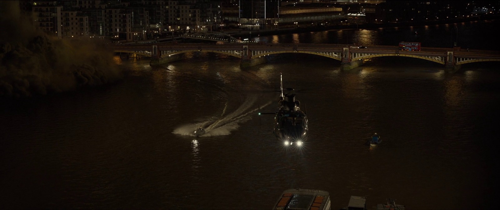 a boat traveling down a river at night