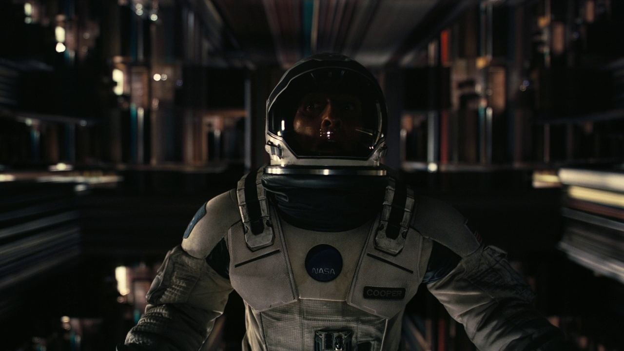 a man in a space suit standing in a library