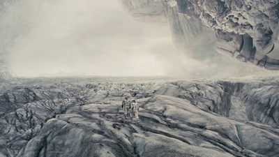 a couple of people standing on top of a glacier