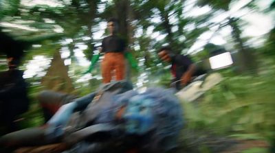 a blurry photo of a group of people in the woods