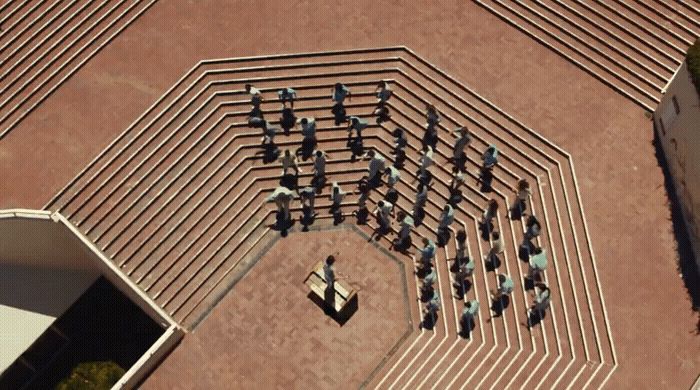 an aerial view of a group of people in a courtyard