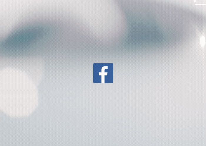 a facebook logo is shown in the middle of a blurry background