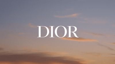 the word dior against a sunset sky