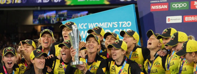 a group of women's soccer players holding a trophy