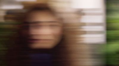 a blurry photo of a woman's face