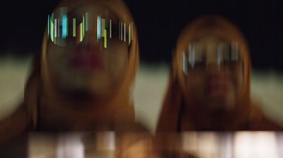 a blurry image of a woman's reflection in a mirror