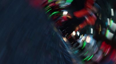 a blurry photo of a ferris wheel at night