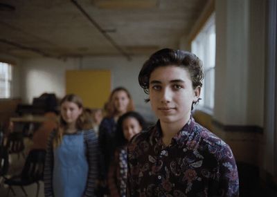 a group of young women standing next to each other