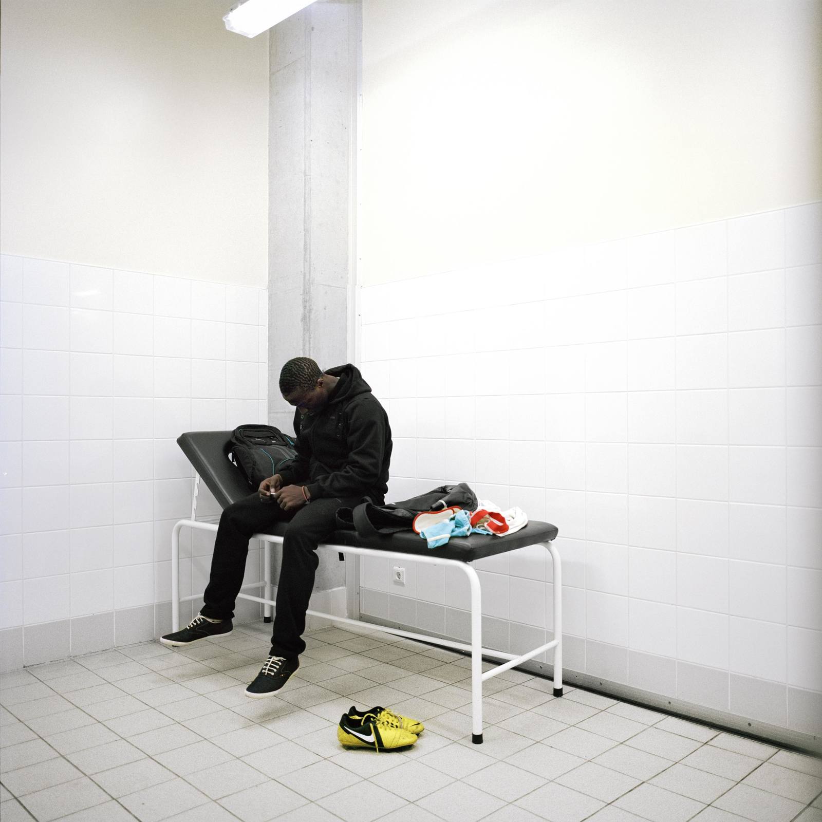 a man sitting on a bench in a room