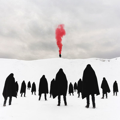 a group of people standing in the snow