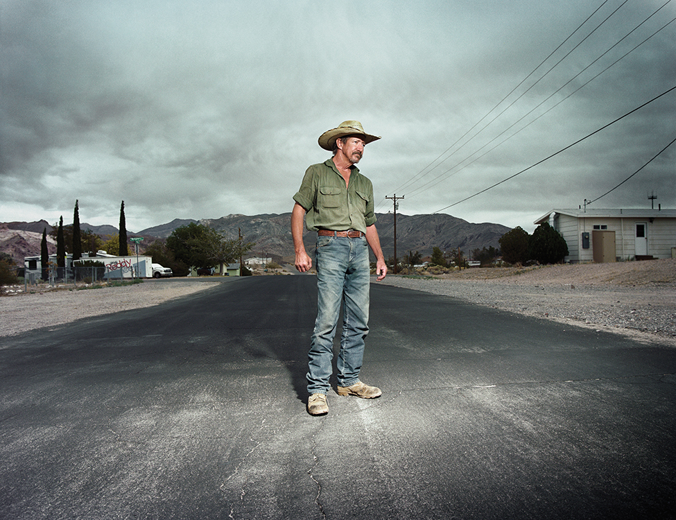 a man standing in the middle of a road