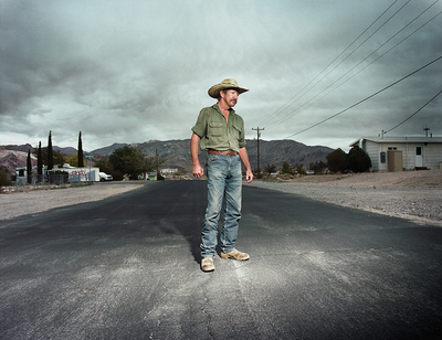 a man standing in the middle of a road