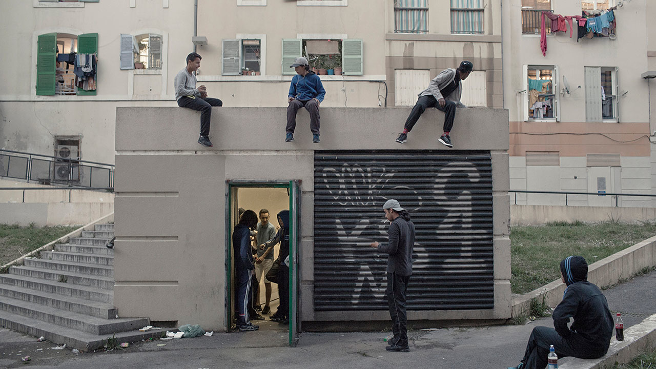 a group of people standing on top of a building