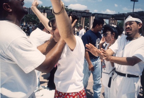 a group of people standing around each other