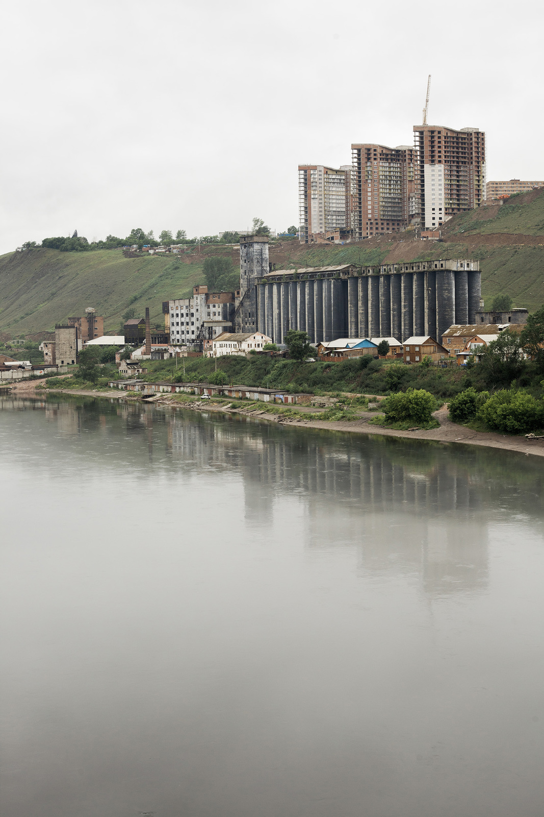 a body of water with a city in the background