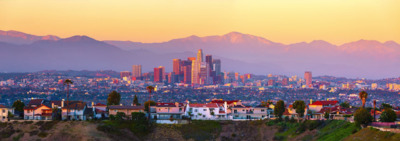 a view of a city with mountains in the background