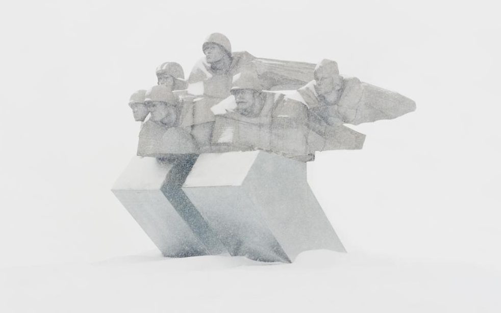 a group of people sitting on top of a sculpture