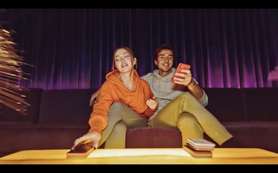 a man and a woman sitting on a couch