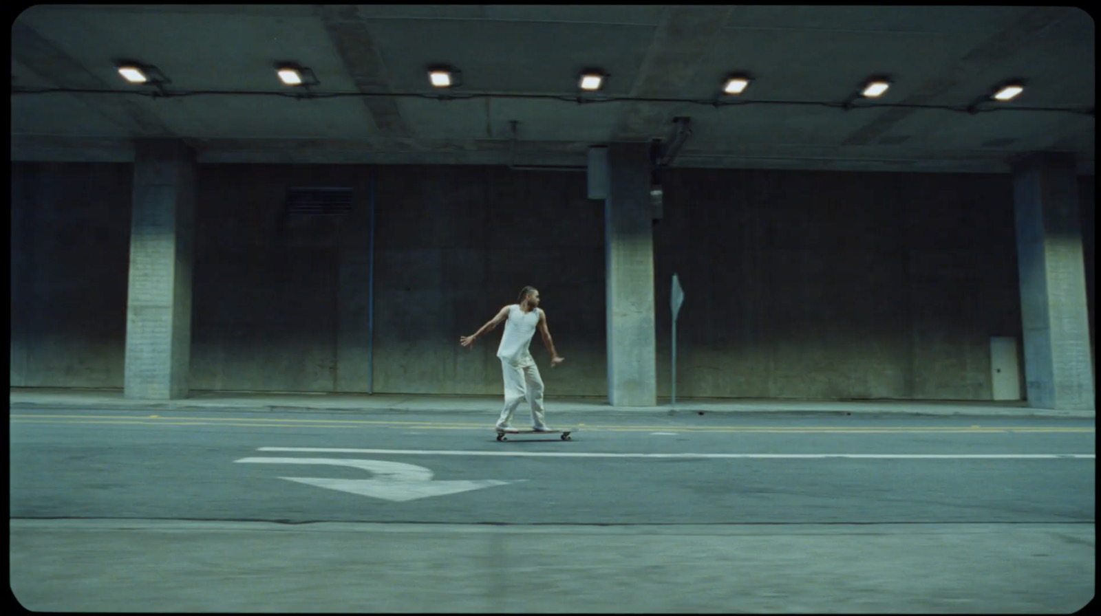 a man riding a skateboard down a street