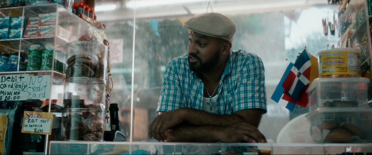 a man sitting at a counter in a store