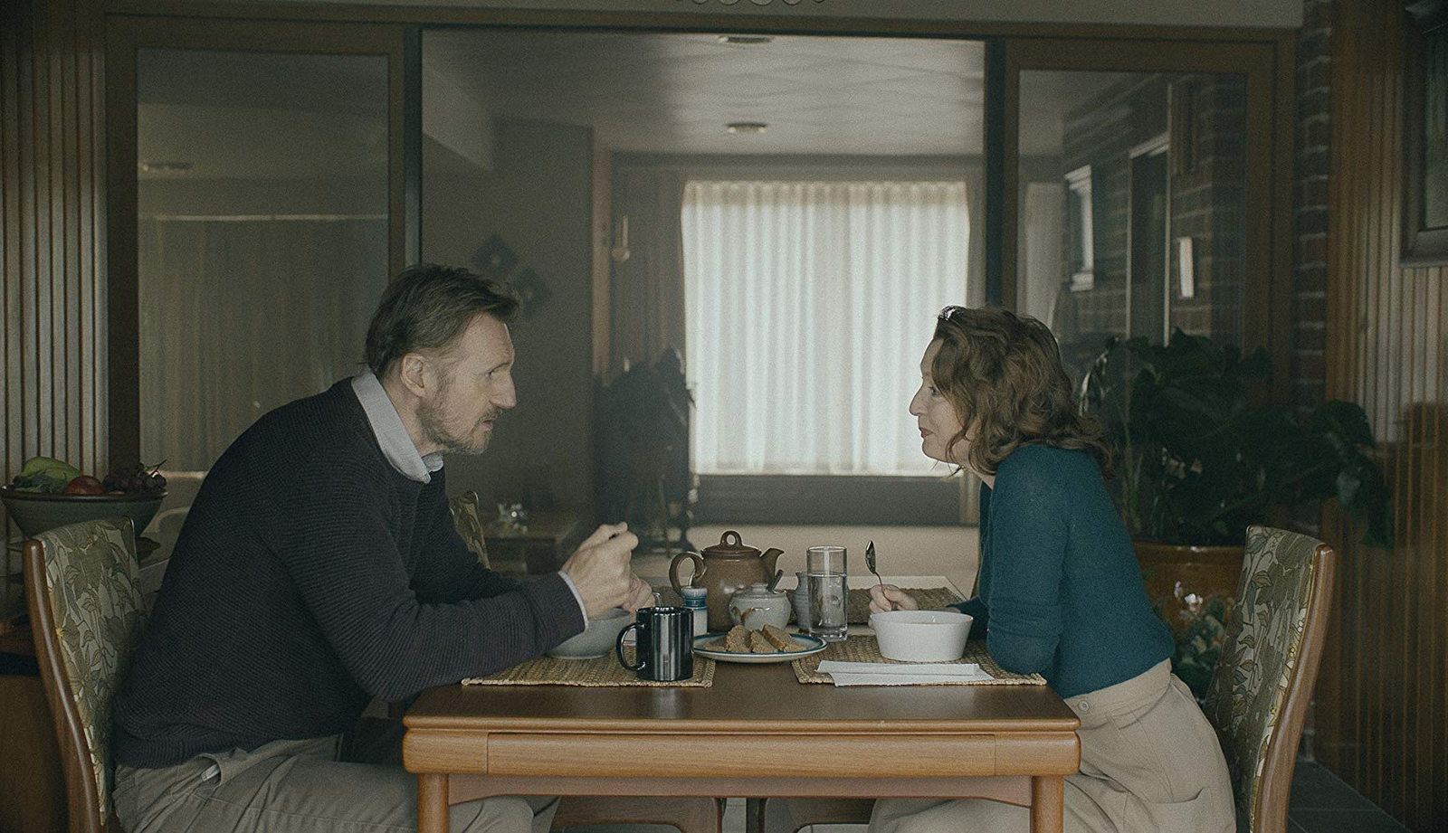 a man and a woman sitting at a table