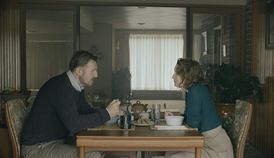 a man and a woman sitting at a table