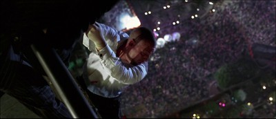 a man standing on top of a stage in front of a crowd