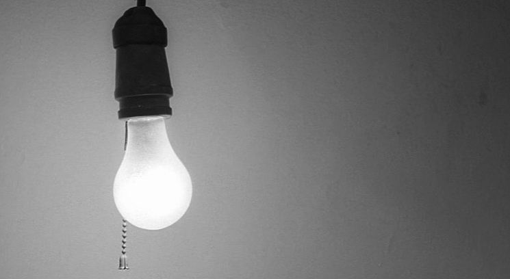 a black and white photo of a light bulb